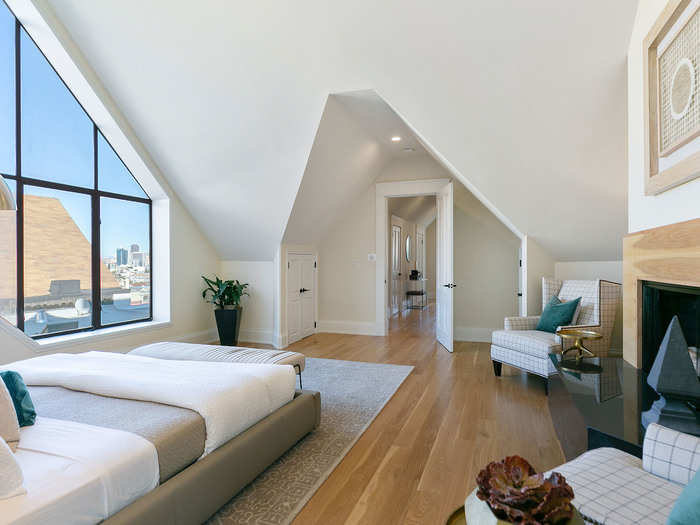 The bedroom, like most rooms in the house, has large windows that let in plenty of natural light, and access to some of the best views in the Bay Area.