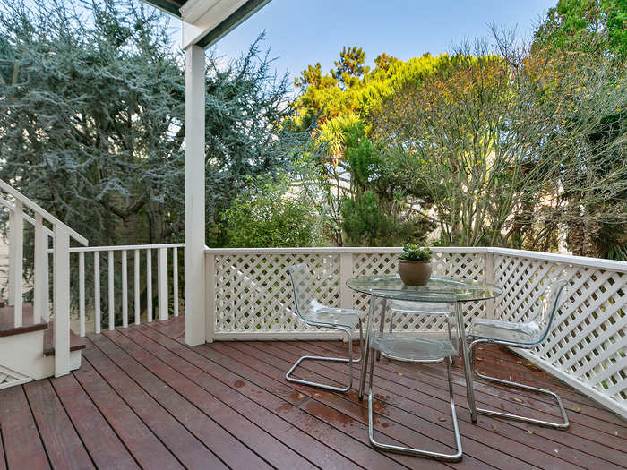 The balcony is private with coverage from trees.