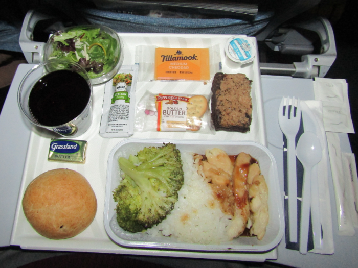 I chose the chicken dish consisting of chicken teriyaki, rice, broccoli that came with a small salad, cheese and crackers, and a chocolate crumb cake. As my only meal for the night, I found it very filling and tasty for airplane food.