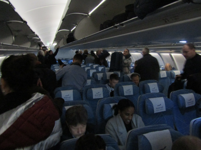 The first thing I noticed about the plane was how dark it was for boarding, giving the cabin an icy feel.