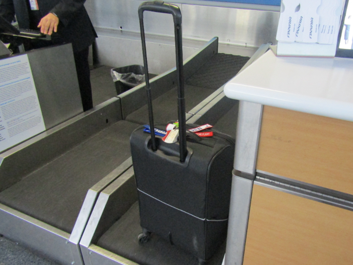 First, my carry-on had to be weighed to ensure it was under the weight limit of 17.5 pounds (it was).