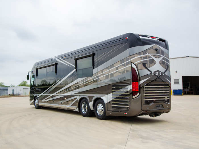 A power washer is located outside of the vehicle to keep the exterior clean.