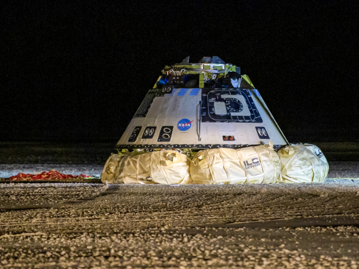 On its early return to Earth, the capsule blew up impact-absorbing airbags and landed safely in the desert.