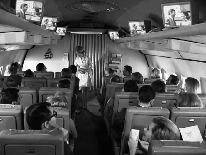Technology may not have been as advanced as it is now, but there was still entertainment on board, with shared screens placed high up above people
