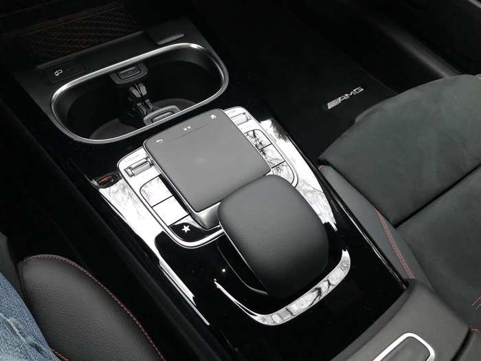 The infotainment system is controlled using a buttons-and-touchpad interface between the seats. It takes some getting used to, but for the most part, it