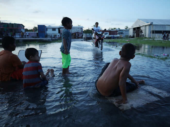 Tuvalu did what it could to draw attention to its plight, too. In 2019, it held the Pacific Islands Forum. Leaders were greeted by a group of children sitting in a moat built around a miniature island, singing, "Save Tuvalu, save the world."