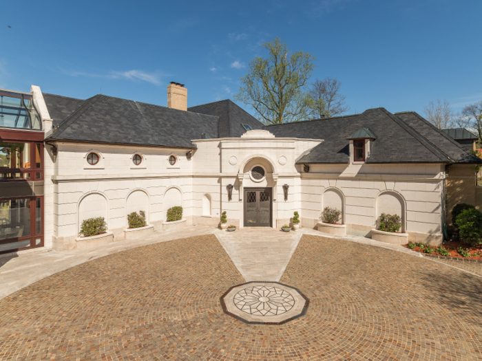 The 3.2-acre estate is made for entertaining, with four kitchens and a champagne refrigerator.