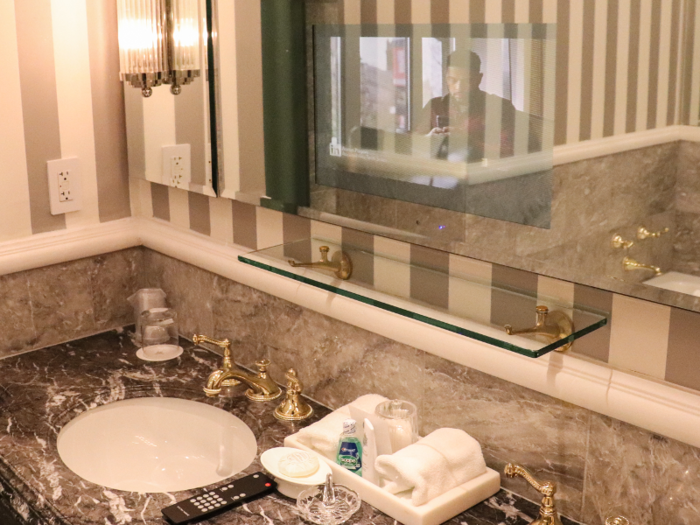 After briefly wondering why there was a remote nestled in among the bath products, I realized there was a TV in the mirror, which I found to be a very exciting feature.