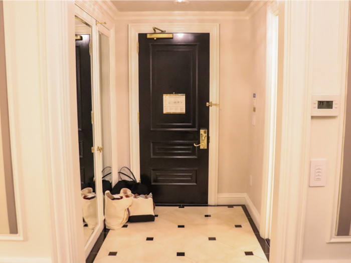 The entryway was adorned with glossy black-and-white tiles.