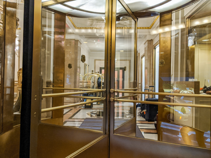 I stepped through the gilded revolving doors into the hotel ...