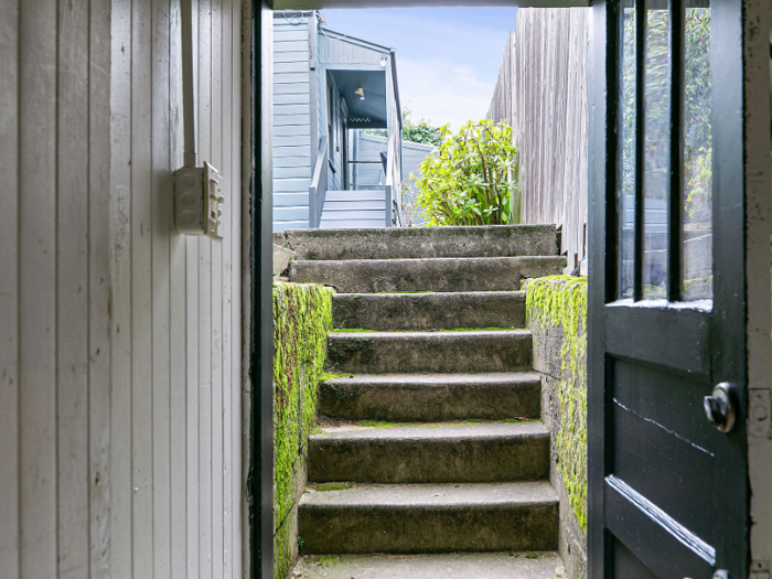 Residents would navigate down a corridor, through a door, up a small set of stairs, and then across the courtyard to get to it.