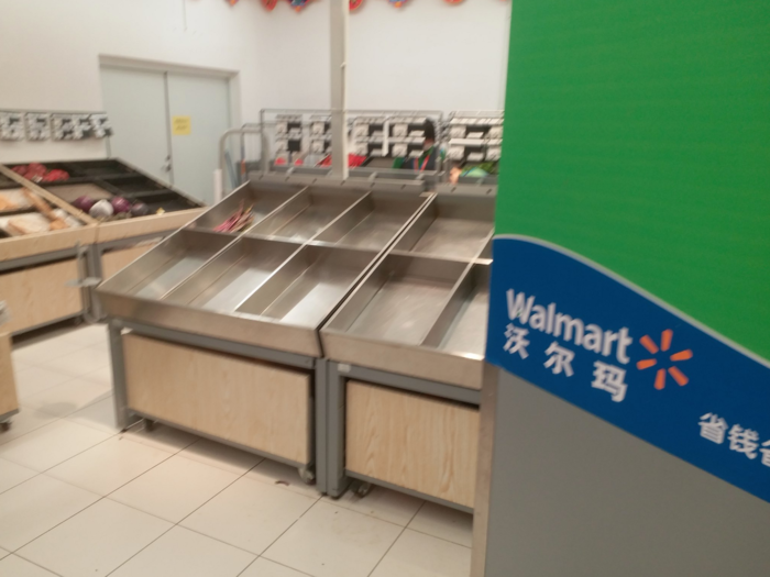 In Wuhan, Walmart shoppers on Wednesday walked in to see shelves that were completely empty of fruits and vegetables.