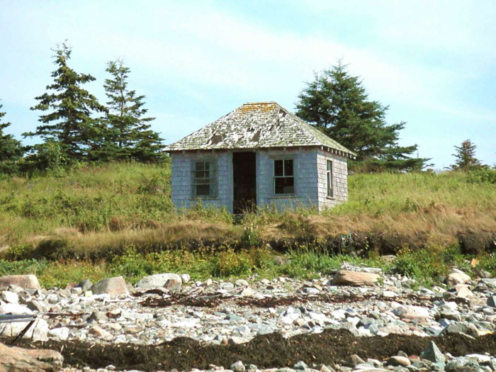 According to the listing, there is a small building at the edge of the island that can be refurbished.