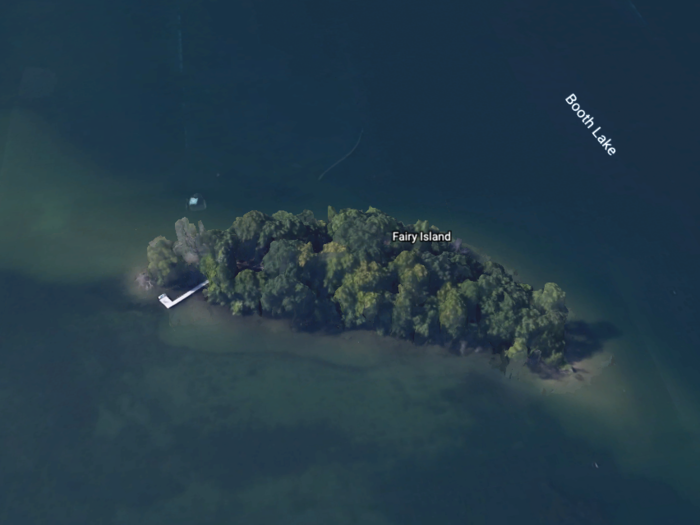 The one-acre island sits on Booth Lake and is around 40 miles from Milwaukee.