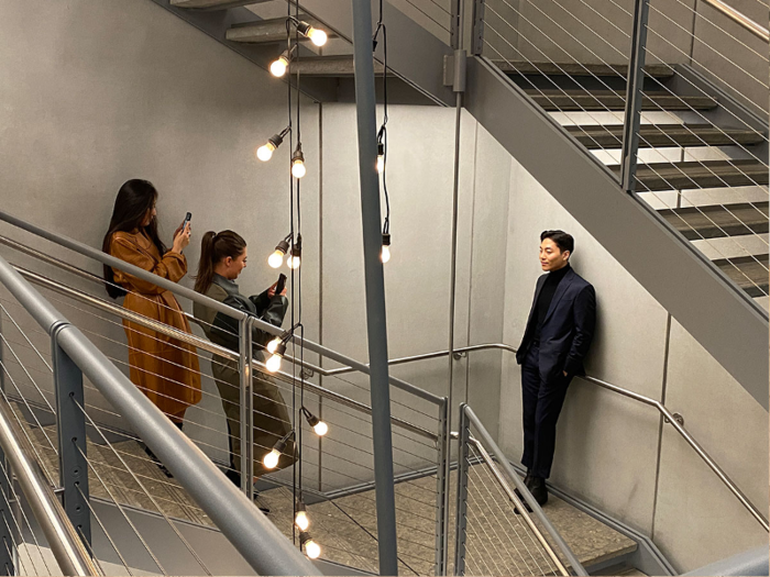 A stairwell decorated with strings of light led guests to a gallery on the second floor.