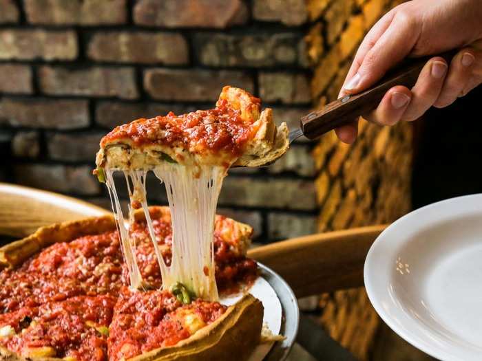 Soon, my small "Special" deep-dish pizza arrived, and my waiter dragged a slice from the pie onto a plate.