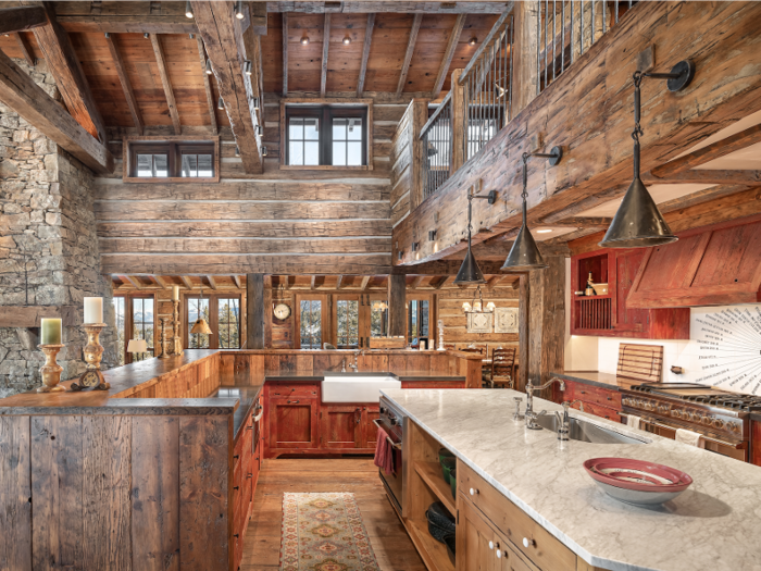 The open kitchen and its oversized center island offer plenty of space for cooking and entertaining.