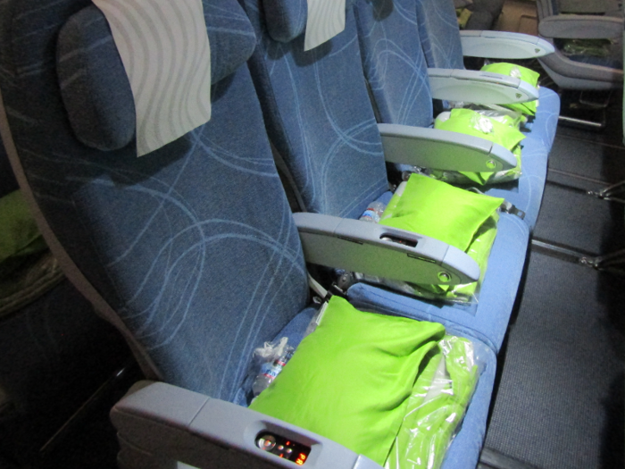 Airlines in Asia are restricting items that are reused, such as pillows, blankets, and magazines.