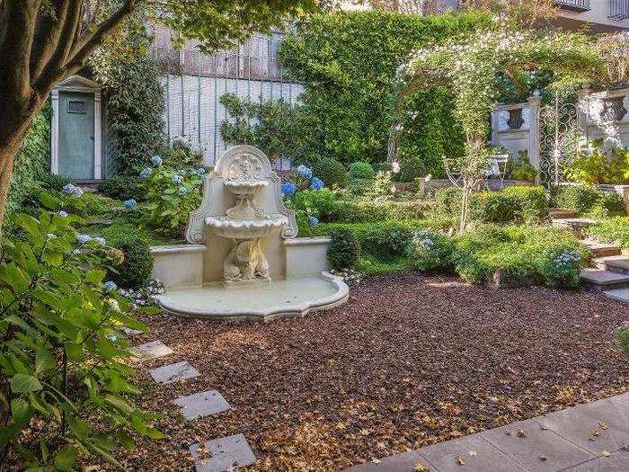 Stone steps lead from the house to the fountain...