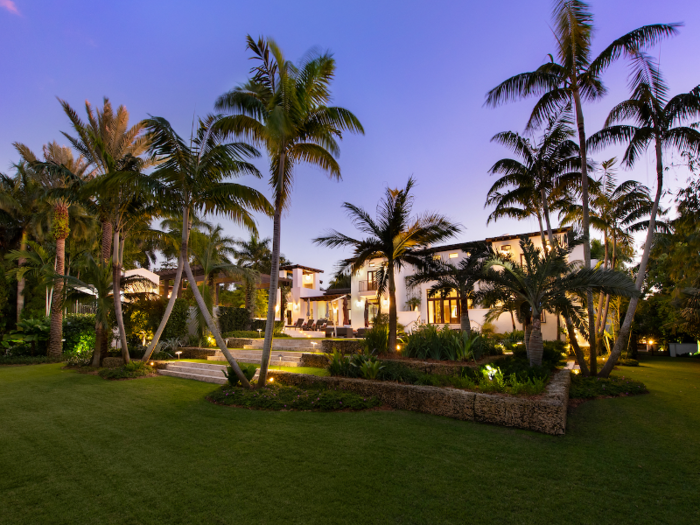 The home comes with a garage that can fit at least five vehicles, an outdoor putting green, and a manicured lawn with a blend of artificial and natural grass.