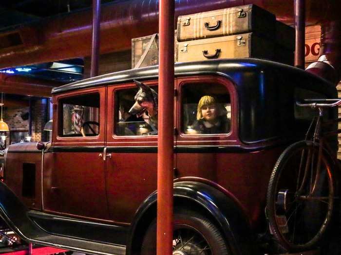 I was creeped out by the uncanny figures of corn-haired children peering at me from a classic car.