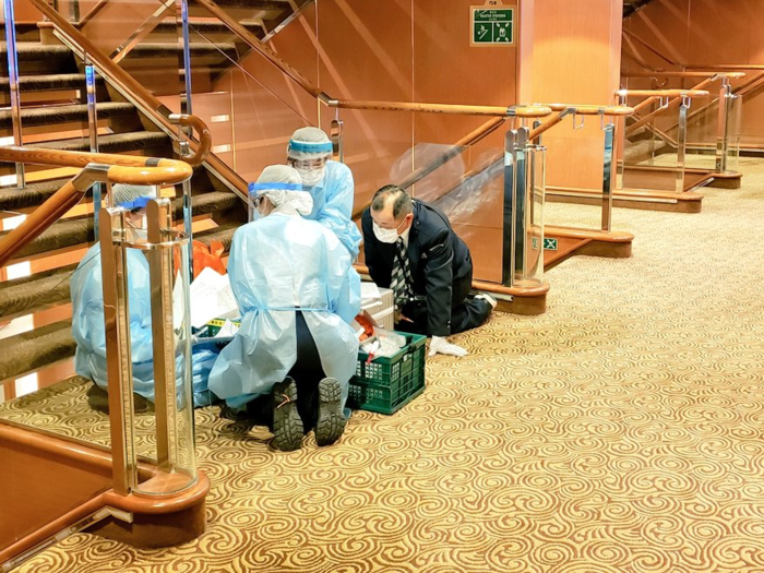 Heavily-protected medical workers have been working in deserted hallways in between testing people for the coronavirus.