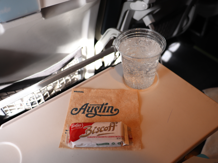 Flight attendants soon came around for the drink and snack service, which consisted of a complimentary soft drink and a delicious Biscoff cookie.