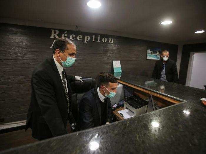 Rais Hotel employees are wearing face masks to lower their chances of catching the virus.