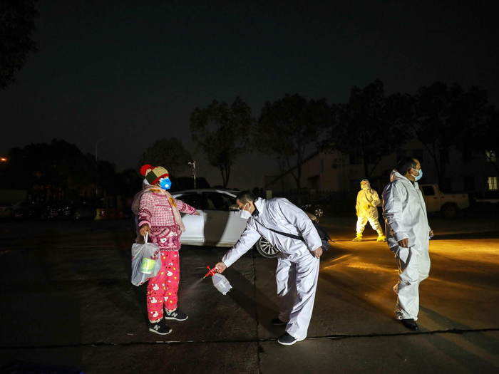 People are disinfected before entering the hotels.