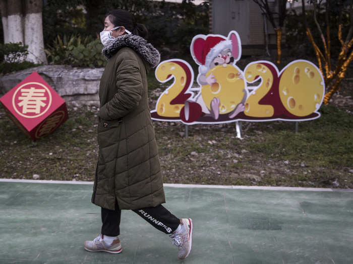 Some people are venturing outside, including to buy supplies. Decorations for Chinese New Year serve as a reminder for how the usually huge holiday is being celebrated much differently this year.