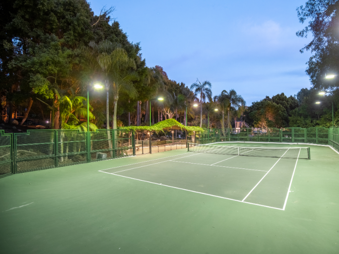 The home also comes with a subterranean eight-car garage and a tennis court.