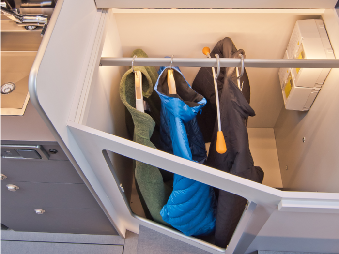 There are storage units at the foot of the bed that doubles as a closet.