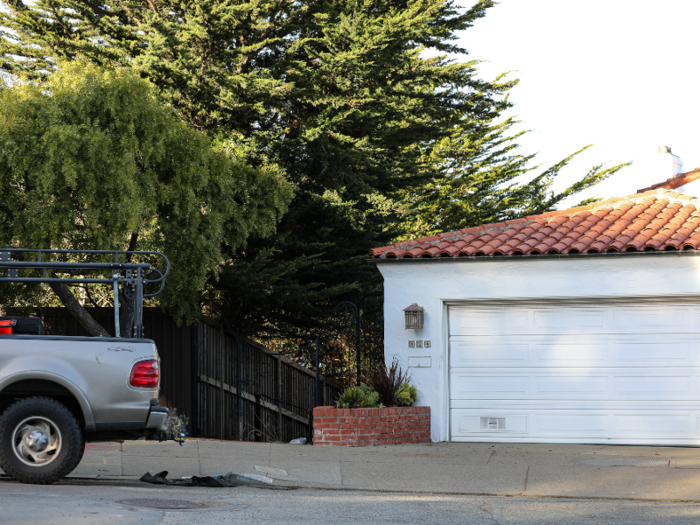 Neither home was visible from the street, but there were workers and construction equipment and materials along the street where the entrances would be.