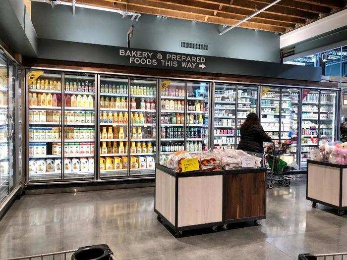 At the end of the hallway, a sign directs shoppers to the bakery and prepared foods.