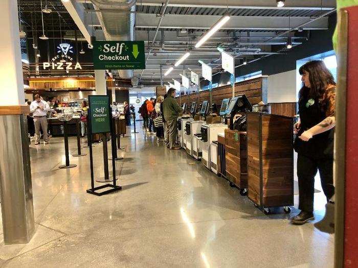 A half dozen self-checkout machines are conveniently located next to the food bars. Whole Foods only recently started adding these to its stores.