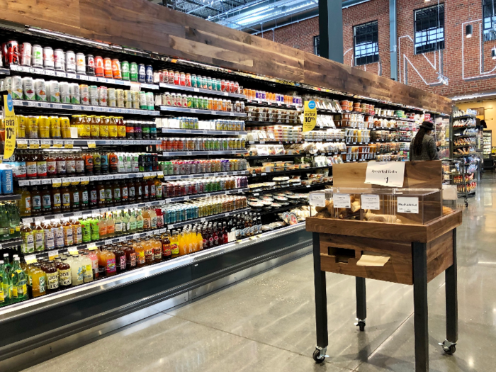 This section features a hot food bar, salad bar, bottled and canned beverages, and grab-and-go food items.