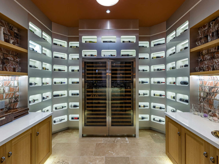 Some indoor amenities include a wine room ...