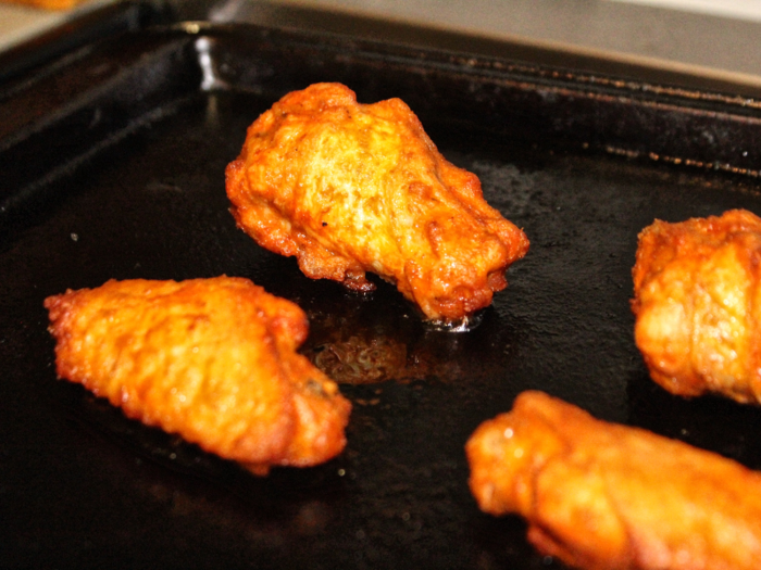 After cooking the frozen wings for about half an hour, I pulled them out of the oven.