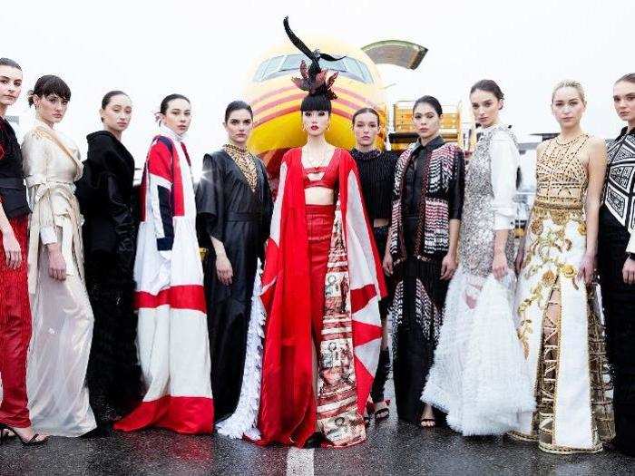 Her designs in gold, white, silver, and black were striking against DHL