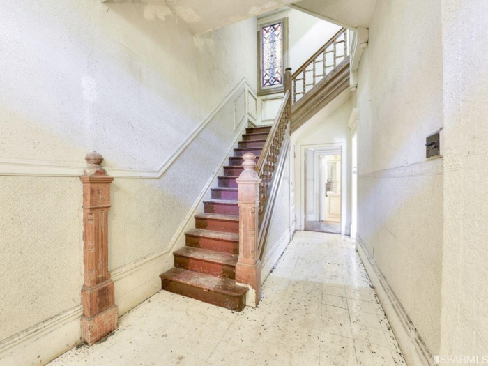 In the 1960s, the single-family home was split into two units. The entryway was made into a common space, with the main floor serving as one unit and the top two floors serving as another.