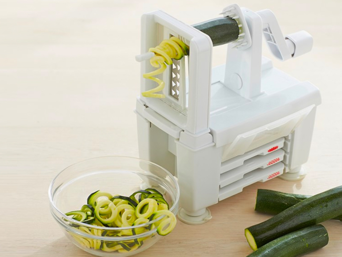 A spiralizer that can turn a vegetable into four different shapes