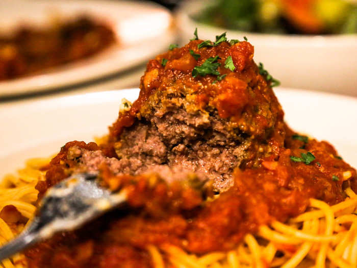 On top of the sprawling mound of spaghetti was the biggest meatball I had ever seen.