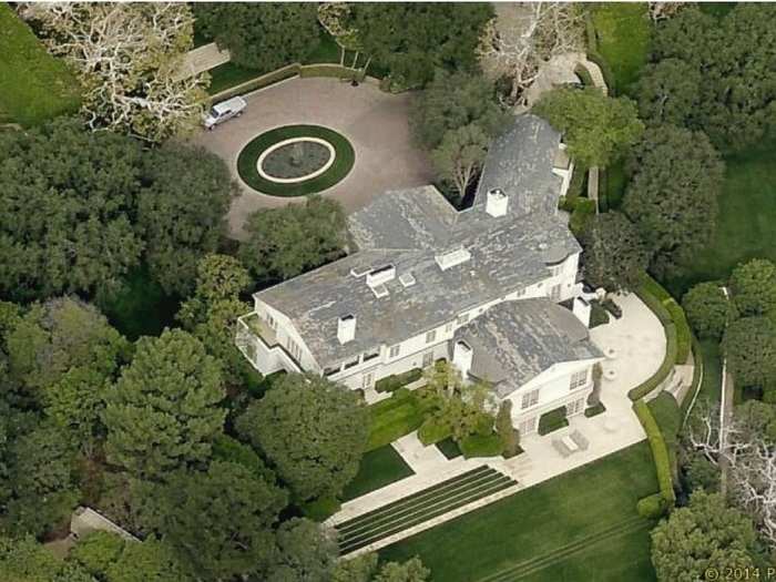 Photos shot of the interior of the estate by Architectural Digest in the early 90s show a screening room, an expansive bar, and a dining room that could easily fit 14 guests.