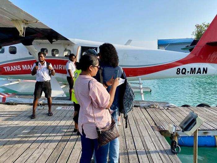 The airline staff member led us to our plane, and waited patiently while we all took photos.