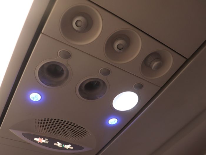 Above the seat was the standard air nozzle and reading light set up, though there was an extra of each for the non-existent middle seat.