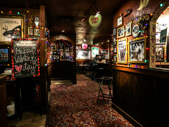 Upstairs, we entered a dimly lit dark wood dining area that was decked out in Valentine