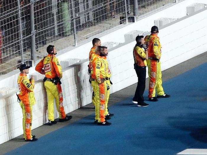 His pit crew watched on in horror as they were kept away from the scene.