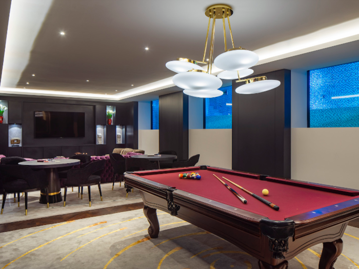 ... a game room that overlooks the pool ...