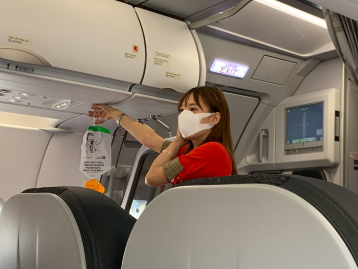 The flight attendants were not wearing bikinis. Instead, they had snazzy red and plaid uniforms.