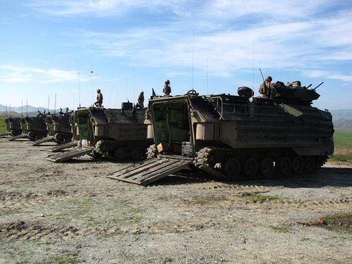 Each AAV can carry around two dozen Marines and their gear.